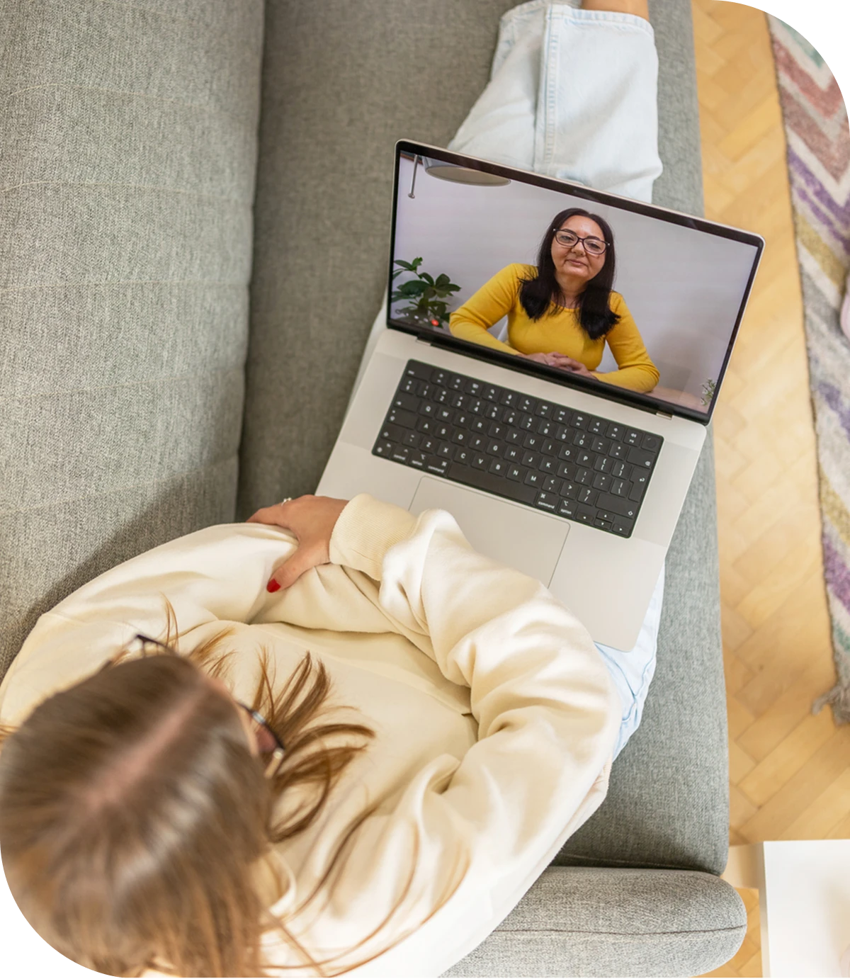 Video call between two women on laptop.